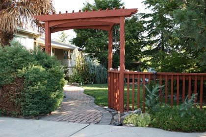 garden gate arbor, fence, paver path entry