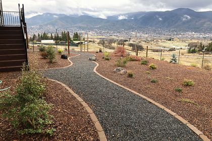 edgestone gravel path with mulched drought tolerant landscaping