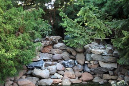 stacked rock garden feature wall with pond